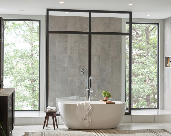 Gray wall tile on a shower wall with freestanding tub